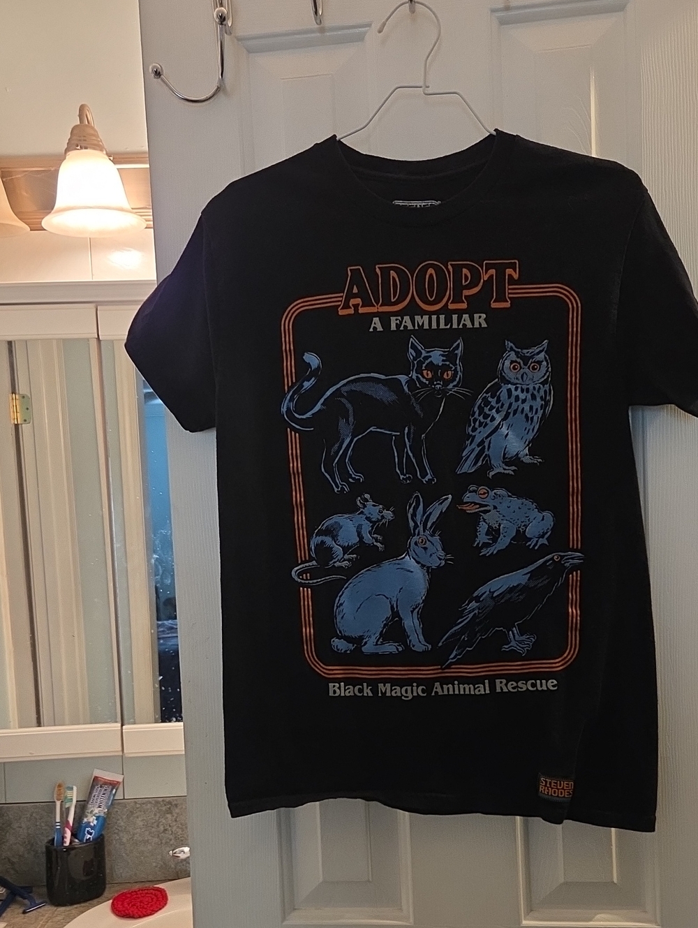 Adopt A Familiar Black Graphic Tee